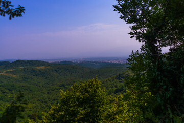 Fototapeta na wymiar SATAPLIA, GEORGIA: View from the Sataplia Nature Reserve from above to the surrounding area and the city of Kutaisi.