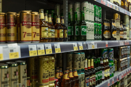 Assortment of beer on the shelves in the store. Side view. Moscow, Russia, 07-02-2021.