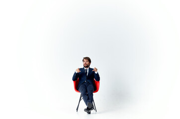 business man in suit sitting on red chair finance office manager