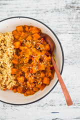 vegan pumpkin and bel pepper curry with brown rice, healthy plant-based food