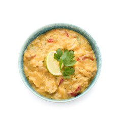 Bowl of tasty chicken curry on white background