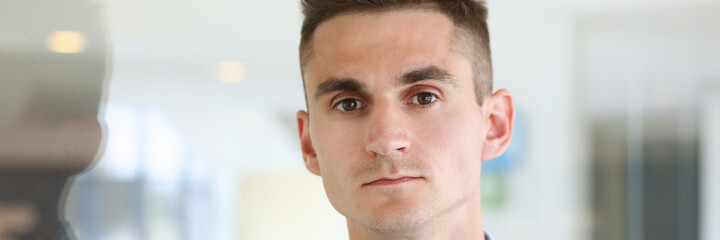 Obraz premium Handsome man in shirt stand in office