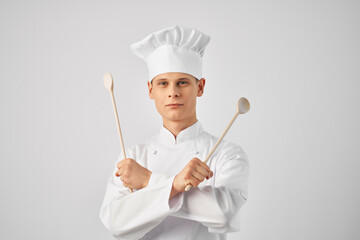 cook with kitchen utensils professional work in a restaurant