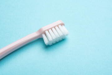 A toothbrush on a blue background