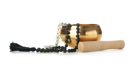 Tibetan singing bowl with beads on white background