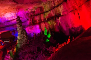 Fotobehang SATAPLIA, KUTAISI, GEORGIA: Sataplia cave in Georgia illuminated by colorful lights. © Anna ART