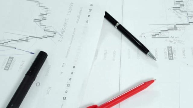 Work desk with papers and stationery.