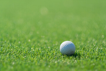 Golf balls on artificial grass with blur background