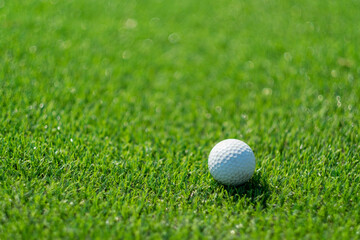 Golf balls on artificial grass with blur background
