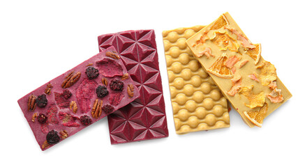 Handmade chocolate bars with fruits, berries and nuts on white background