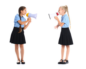 Cute schoolgirls with megaphones on white background