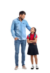 Little schoolgirl with her father on white background