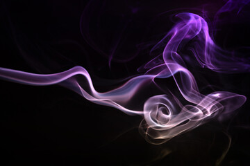 Obraz premium Abstract colored smoke hookah on dark background. Texture. Art Design element. Personal vaporizers fragrant steam. Concept of alternative non-nicotine smoking. E-cigarette. Evaporator.