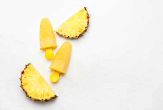 Tasty pineapple popsicles on white background - Powered by Adobe