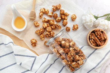 Caramel popcorn spilled out from the bottle - Flat lay tasty snack