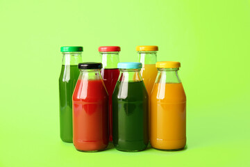 Different healthy juice on color background