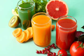 Different healthy juice on color background