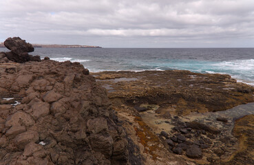 Gran Canaria, calm natural seawater pools in under the steep cliffs of the north coast and separated from the ocean by volcanic rocks,
Sardina del Norte area