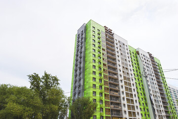 Fototapeta premium Construction of a new multi-storey residential house