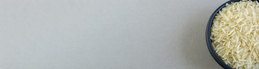 basmati rice in a black plate on a gray background