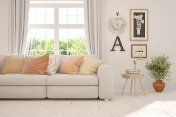 Fototapeta premium Minimalist living room in white color with sofa and summer landscape in window. Scandinavian interior design. 3D illustration