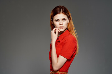 red-haired woman in red dress posing attractive look isolated background