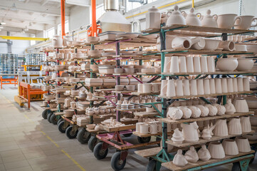 Dishes on the shelves in ceramics factory