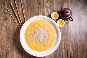 traditional chinese teo chew hot yam taro sweet paste ou nei with mango sago coconut cream sauce on wood background asian halal dessert menu