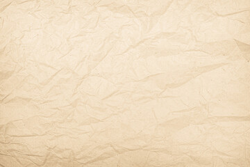 Brown recycled paper crumpled texture background. Cream Old vintage page or grunge vignette parchment old blank newspaper. Pattern empty rough cardboard creased grunge surface backdrop with space.
