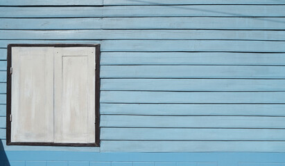 White  window on a wooden wall
