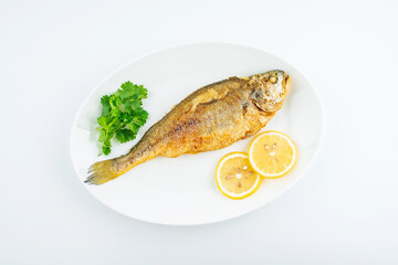 A fried yellow croaker on white background