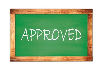 Obraz premium APPROVED text written on green school board.