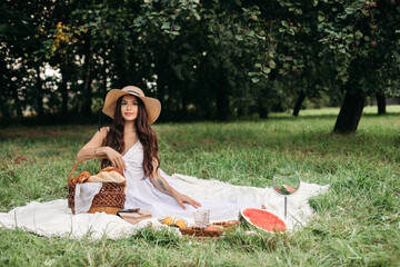 Beautiful Caucasian woman at picnic. Full length stock photo