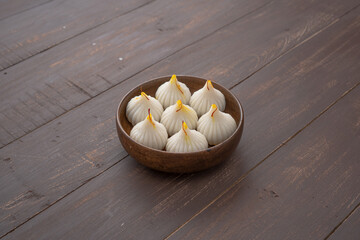 Steamed Modak, ukdiche modak, white modak made from rice flour and coconut jaggery filling. Modak is a traditional Indian sweet made during Ganesh Utsav and also offered to Lord Ganesha.
