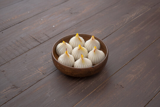 Steamed Modak, ukdiche modak, white modak made from rice flour and coconut jaggery filling. Modak is a traditional Indian sweet made during Ganesh Utsav and also offered to Lord Ganesha.