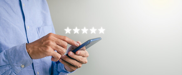 Cover the guy's hand using a smartphone and give the five-star symbol to increase the customer...