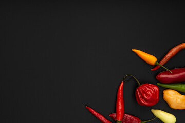 Some pepper on black background