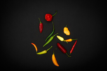 Some pepper on black background