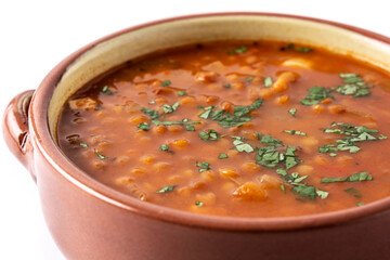 Red lentil soup isolated on white background. Close up