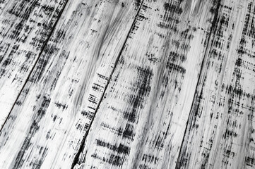 Old scratched black and white wood plank background