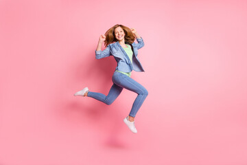 Fototapeta na wymiar Full size profile side photo of young cheerful girl happy positive smile jump go walk run isolated over pink color background