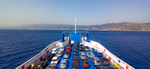many cars on the ferry with Sicily on the bottom. Departure for holidays. Strait of Messina