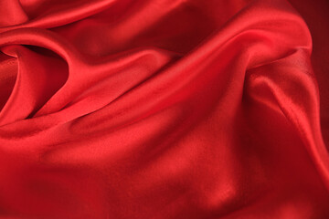 Fototapeta na wymiar abstract texture of draped red velvet background. eautiful textile backdrop. Close-up. Top view