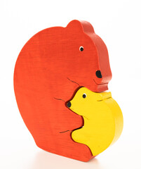 Wooden mother and baby bear puzzle on white background