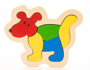 Wooden dog puzzle on white background