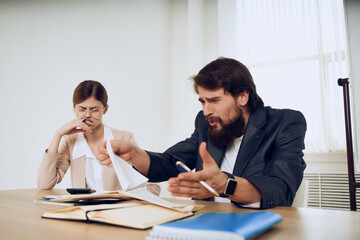 business men and women work desk message emotions professionals work colleagues