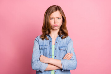 Photo of young attractive girl folded hands unhappy upset sad offended isolated over pink color...
