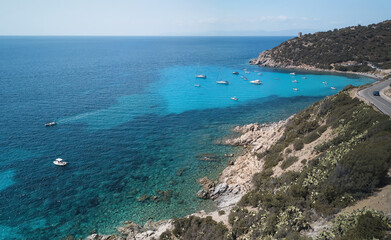 Fototapeta na wymiar Aerial view of turquoise sea in the little bay in the south of Sardinia (CALA REGINA) travel destination .