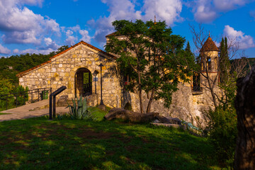 Fototapeta na wymiar KUTAISI, GEORGIA: Old Orthodox Motsameta Monastery or Saints David and Constantine Monastery on a sunny summer day.