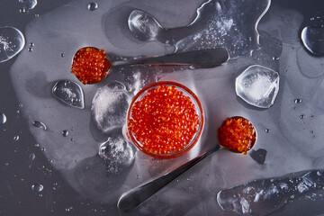 Salmon roe with ice on metal